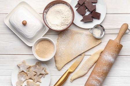 Composition with raw cookies and ingredients on light wooden backgroundの写真素材