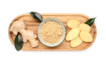 Wooden board with fresh ginger root and bowl of dried powder on white backgroundの写真素材