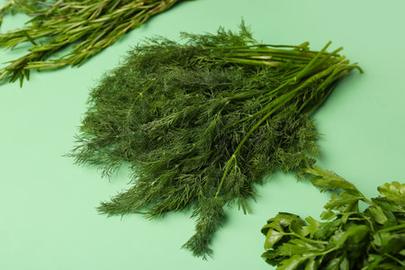 Bunches of fresh parsley, dill and rosemary on color background, closeupの写真素材