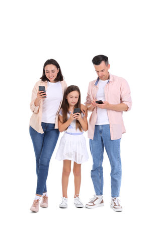 Happy family with mobile phones isolated on white backgroundの写真素材