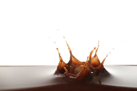 Splash of hot chocolate on white backgroundの写真素材