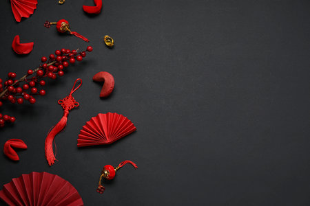 Composition with Chinese symbols and fortune cookies on dark background. New Year celebrationの写真素材