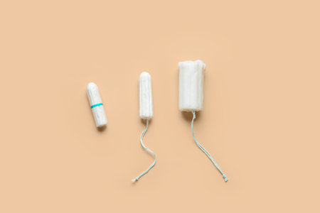 Different menstrual tampons on beige backgroundの写真素材