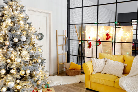 Interior of living room with Christmas tree, yellow sofa and folding screenの写真素材
