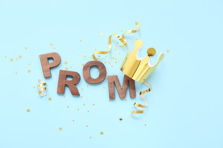 Word PROM with crown and confetti on blue backgroundの写真素材