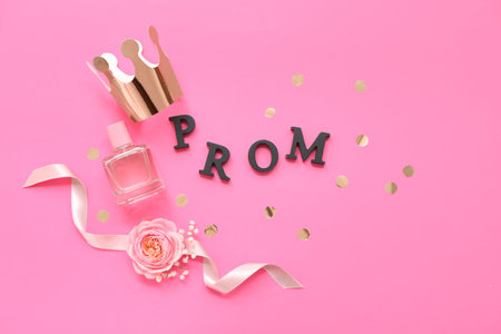 Word PROM with crown perfume bottle and boutonniere on pink backgroundの写真素材