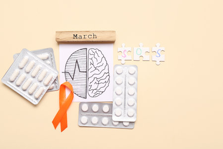 Drawing of brains with orange ribbon, pills and word MARCH on beige background. Multiple Sclerosis Awareness Monthの写真素材