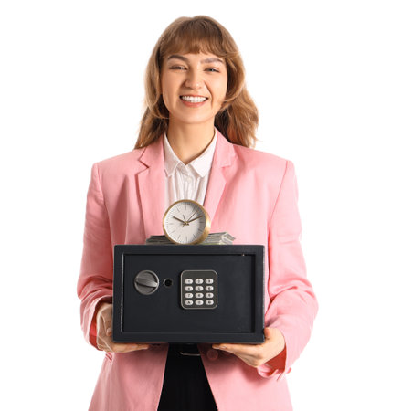 Beautiful young happy woman with safe box, money and clock isolated on white backgroundの写真素材
