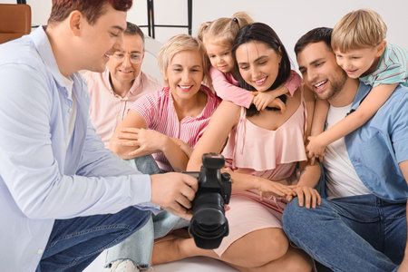 Big family looking at taken pictures in studio
