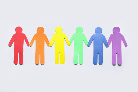 Colorful paper human figures on light background. LGBTQ conceptの写真素材