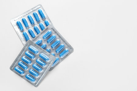 Blister packs with pills on white backgroundの写真素材