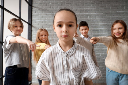 Bullied little girl at school, closeupの写真素材