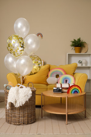 Basket with balloons and toys rainbow at homeの写真素材