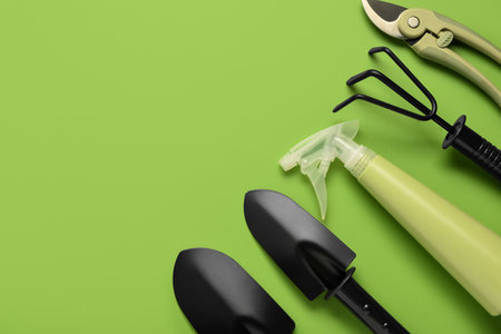 Set of gardening tools on green backgroundの写真素材