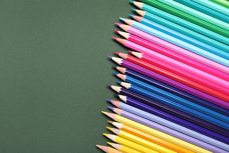 Set of colorful pencils on green backgroundの写真素材