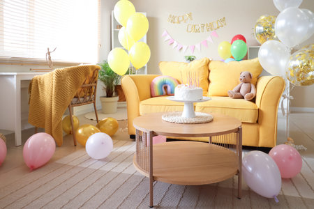 Cute children's room with balloons, toys and birthday cake