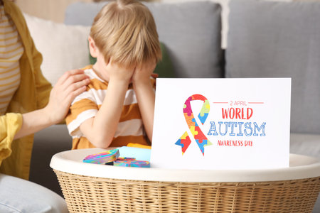 Paper card on table at child psychologist's office, closeup. World Autism Awareness Dayの写真素材