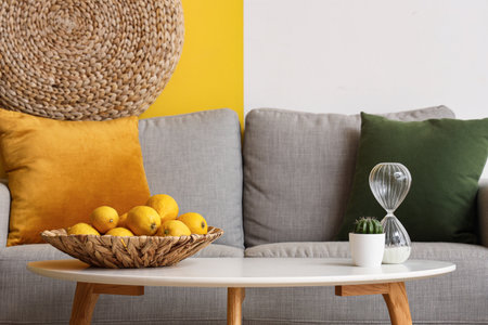 Comfortable sofa with pillows and coffee table in living roomの写真素材