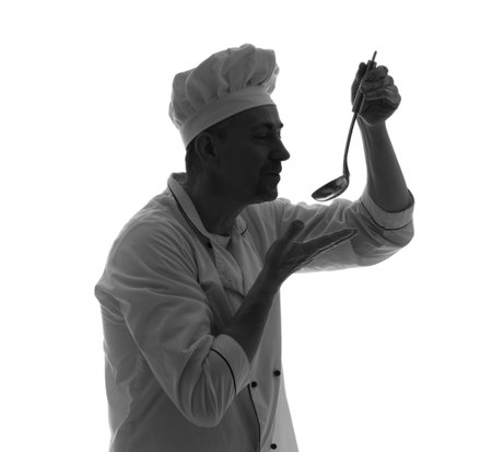 Silhouette of mature chef with ladle on white backgroundの写真素材