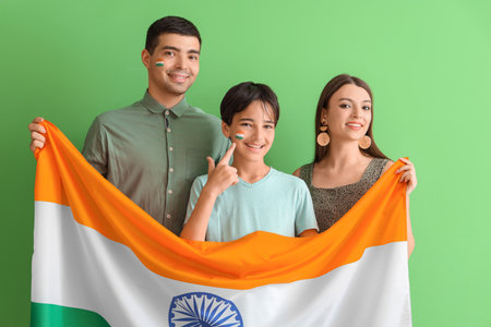 Happy family with Indian flag on green backgroundの写真素材