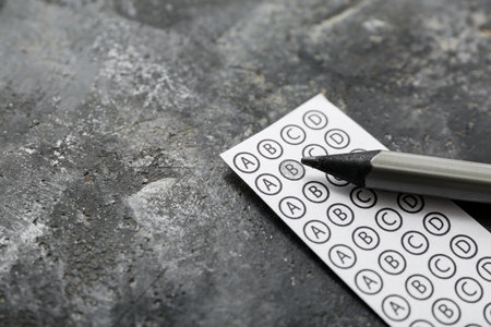 Quiz form with pencil on grunge black backgroundの写真素材