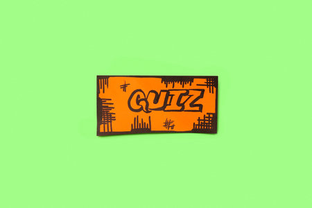 Paper quiz card on green background