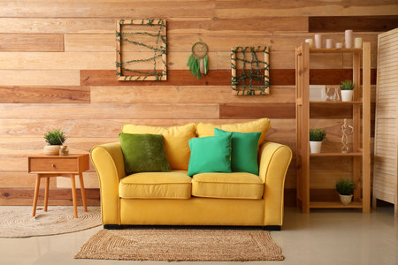 Interior of living room with frames and dream catcher on wooden wallの写真素材