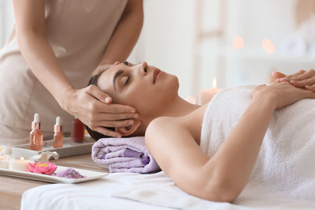 Young woman getting massage in spa salon, closeupの写真素材