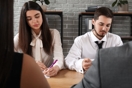 Human resources commission interviewing applicants in officeの写真素材
