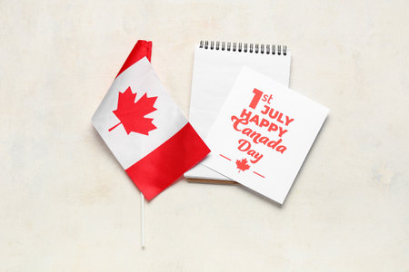Greeting card, Canadian flag and notebook on white background. Canada Day conceptの写真素材