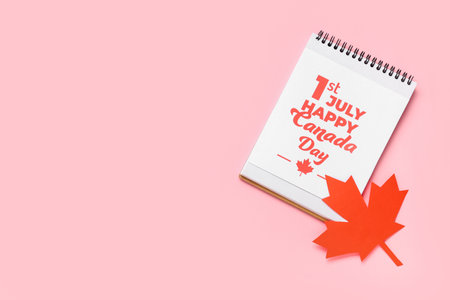 Greeting card and Maple leaf on pink background. Canada Day conceptの写真素材