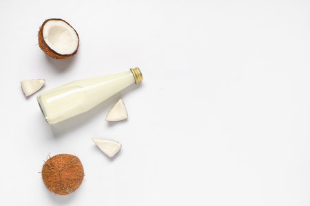 Bottle of natural coconut milk on white backgroundの写真素材