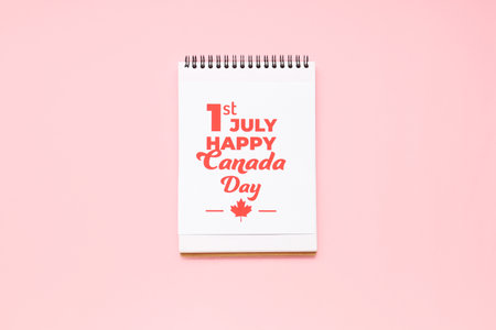 Greeting card and notebook on pink background. Canada Day conceptの写真素材