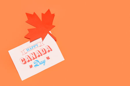 Maple leaf and greeting card on red background. Canada Day conceptの写真素材