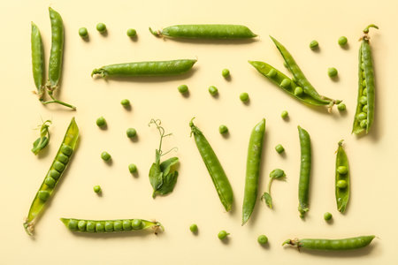 Green peas on beige backgroundの写真素材