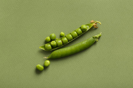 Fresh peas on green backgroundの写真素材