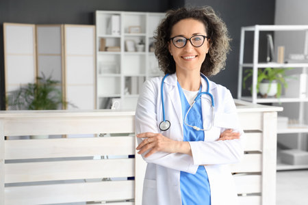 Portrait of mature female doctor in clinicの写真素材