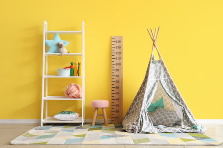 Interior of playroom with toys and teepee in kindergartenの写真素材
