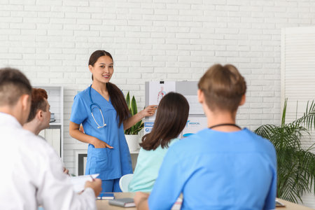 Female Asian doctor working with her colleagues in clinicの写真素材