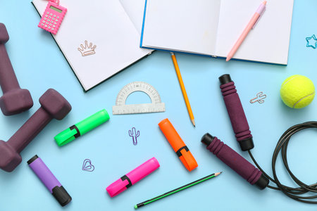 Composition with different stationery and sports equipment on color background