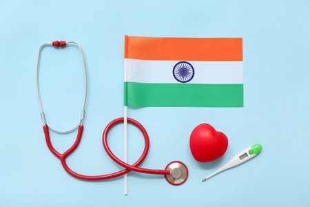 Stethoscope, heart, thermometer and flag of India on blue background. National Doctor's Day celebrationの写真素材
