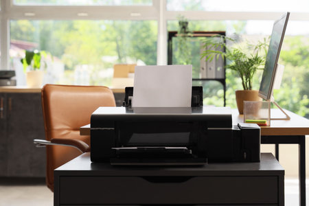 Modern printer on chest of drawers in office, closeupの写真素材