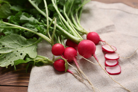 Fresh radishes on wooden backgroundの写真素材