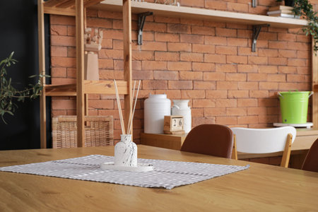 Table with reed diffuser in room