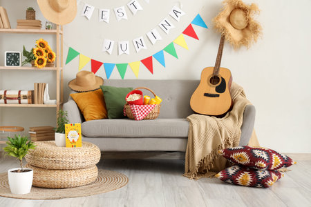 Interior of festive living room with gray sofa and decorations for Festa Junina celebration