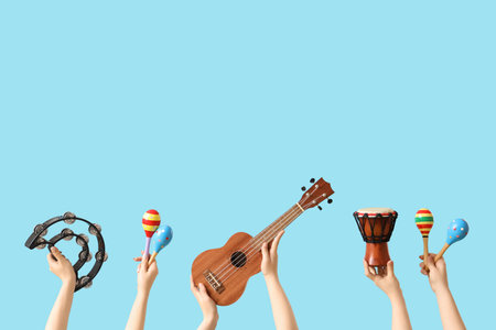 Women with different musical instruments on blue backgroundの写真素材