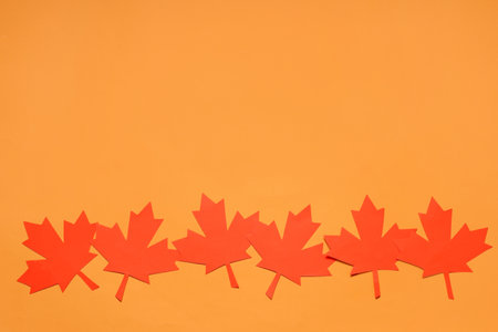 Maple leaves on orange background. Canada Day conceptの写真素材