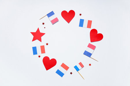 Frame made from French flags, hearts and stars on white background. Bastille Day celebrationの写真素材
