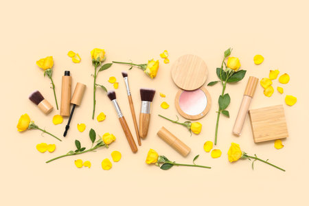 Beautiful composition with flowers and decorative cosmetics on beige backgroundの写真素材