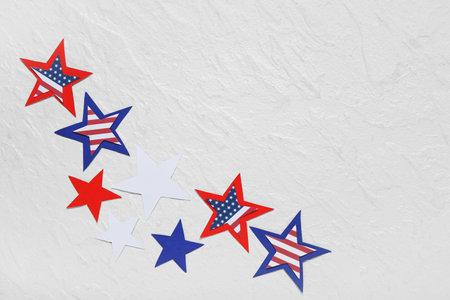 Stars in colors of USA flag on gray background. American Independence Day celebrationの写真素材